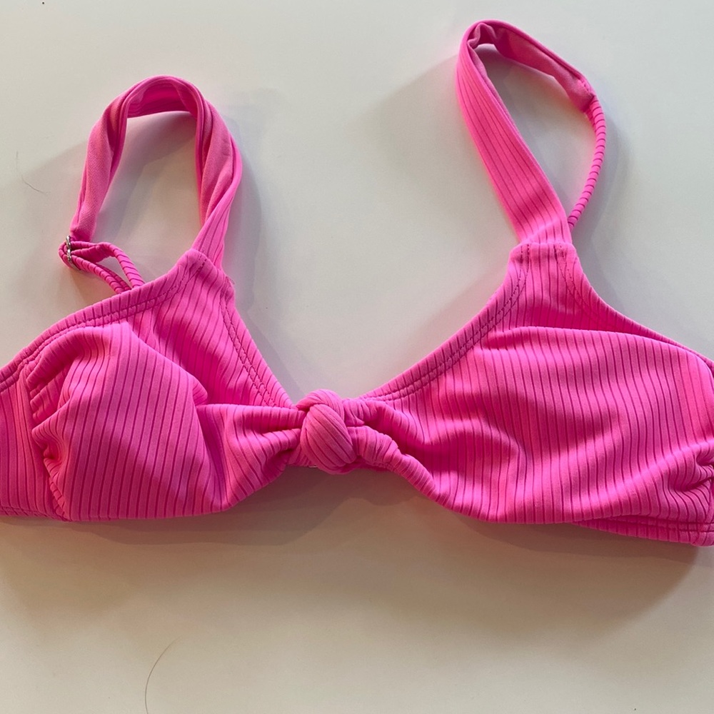 This top is a little low but fits well and is a size S.